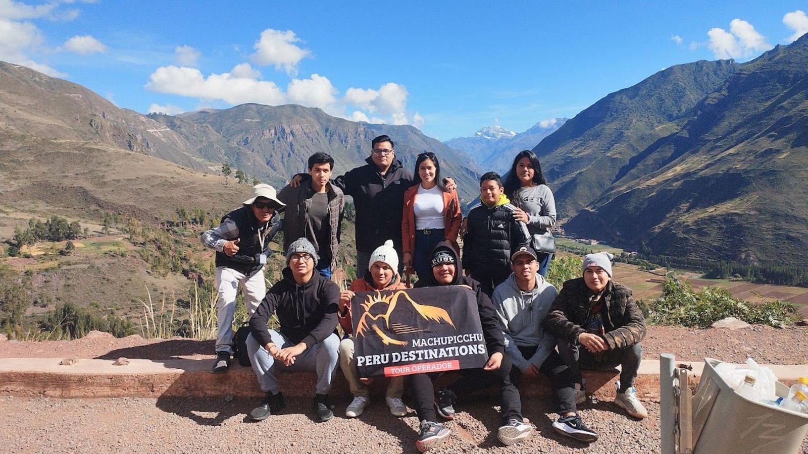 Travelers visiting Pisac in the Sacred Valley on a guided tour near Cusco, Peru